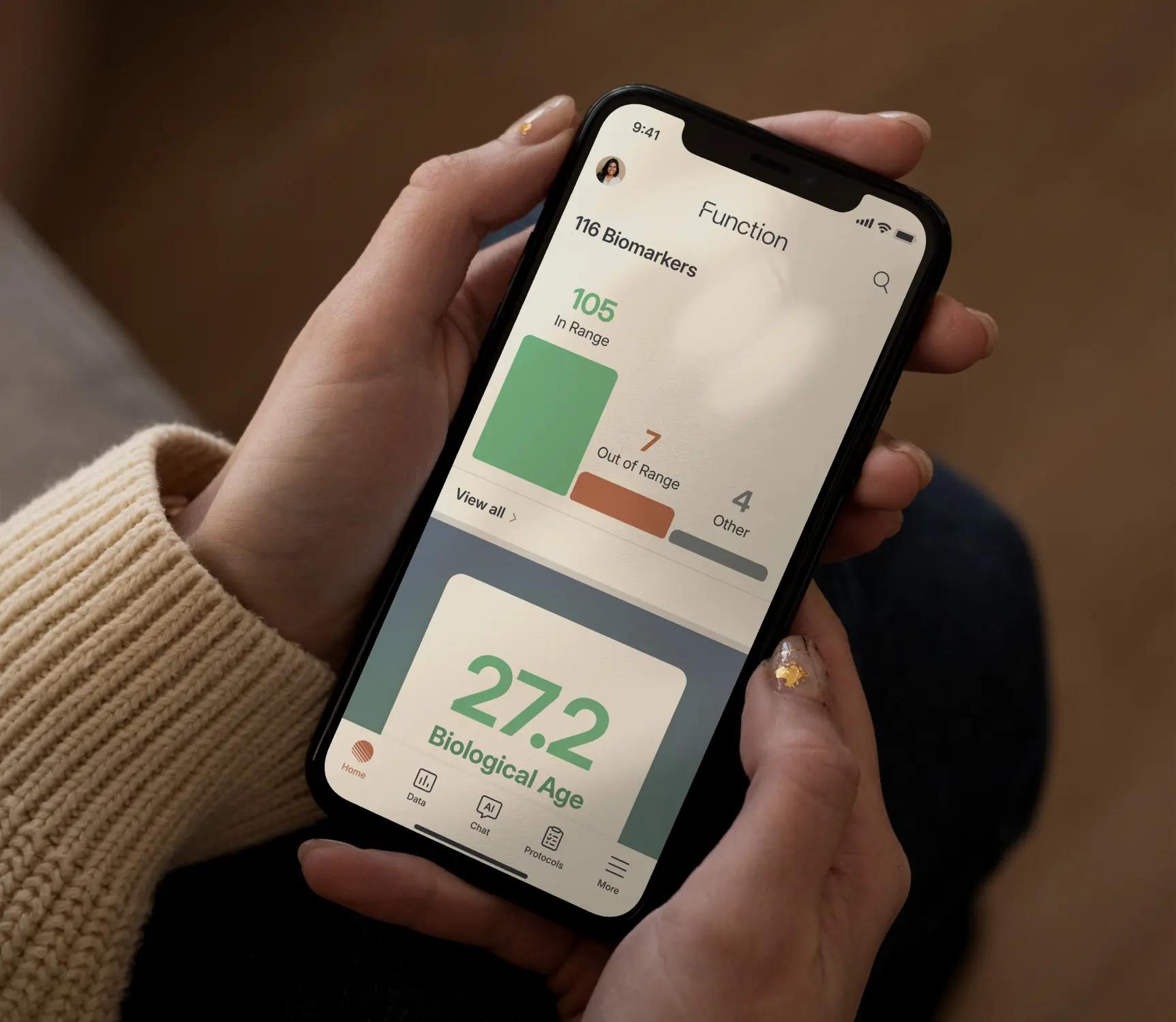 Person holding the Function app showing biomarker insights