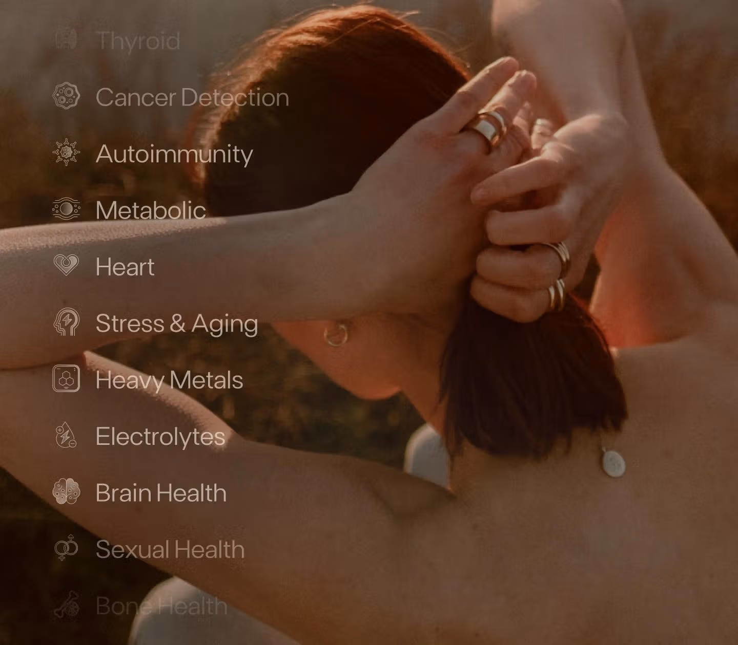Short-haired woman with golden background with an overlay of the categories of tests Function covers, including Heart, Metabolic, and Brain Health