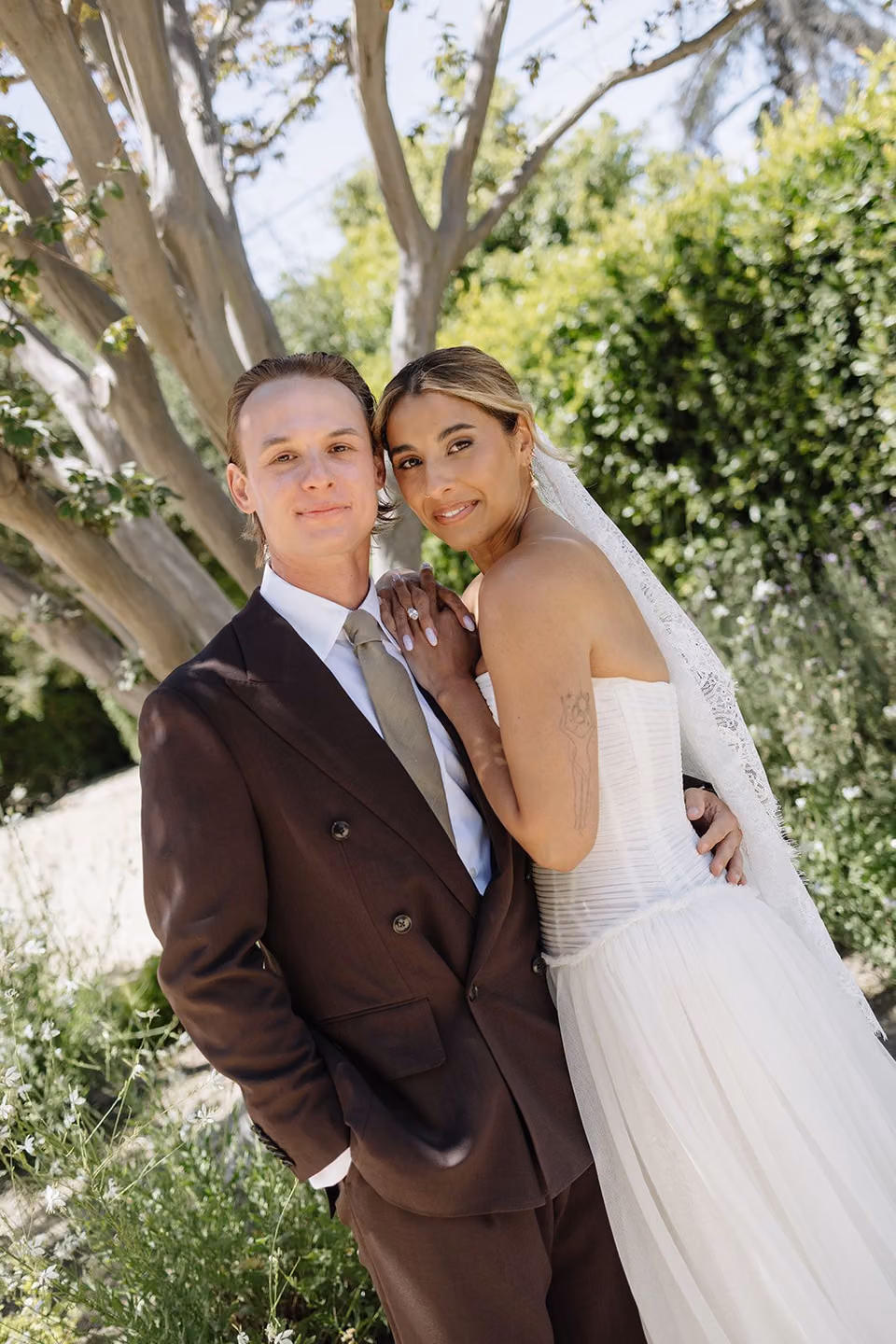 Lauren and her fiancé outdoors on their wedding day.